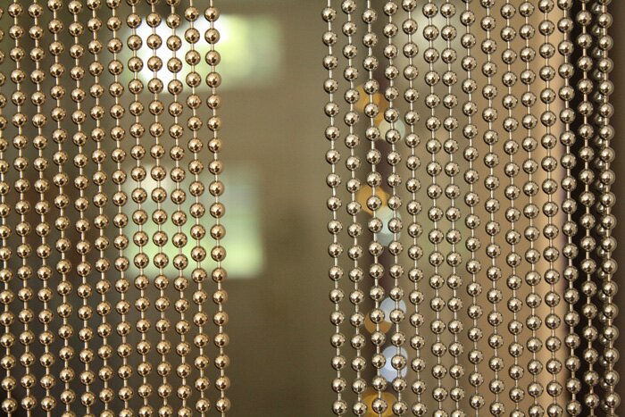 Gold beaded curtains suitable for bar or restaurant as a space divider